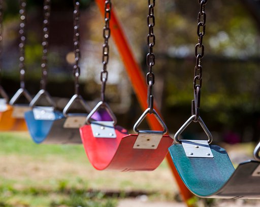 Empty colorful swings at the park